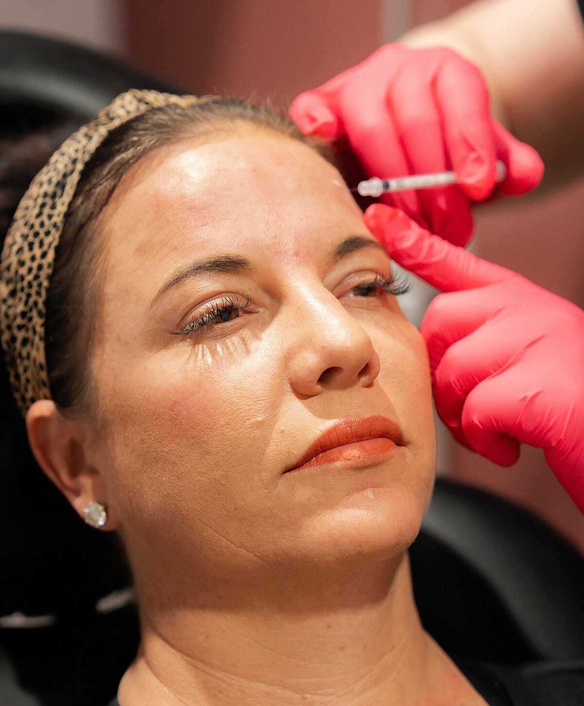 Client enjoying a beauty treatment at salon.