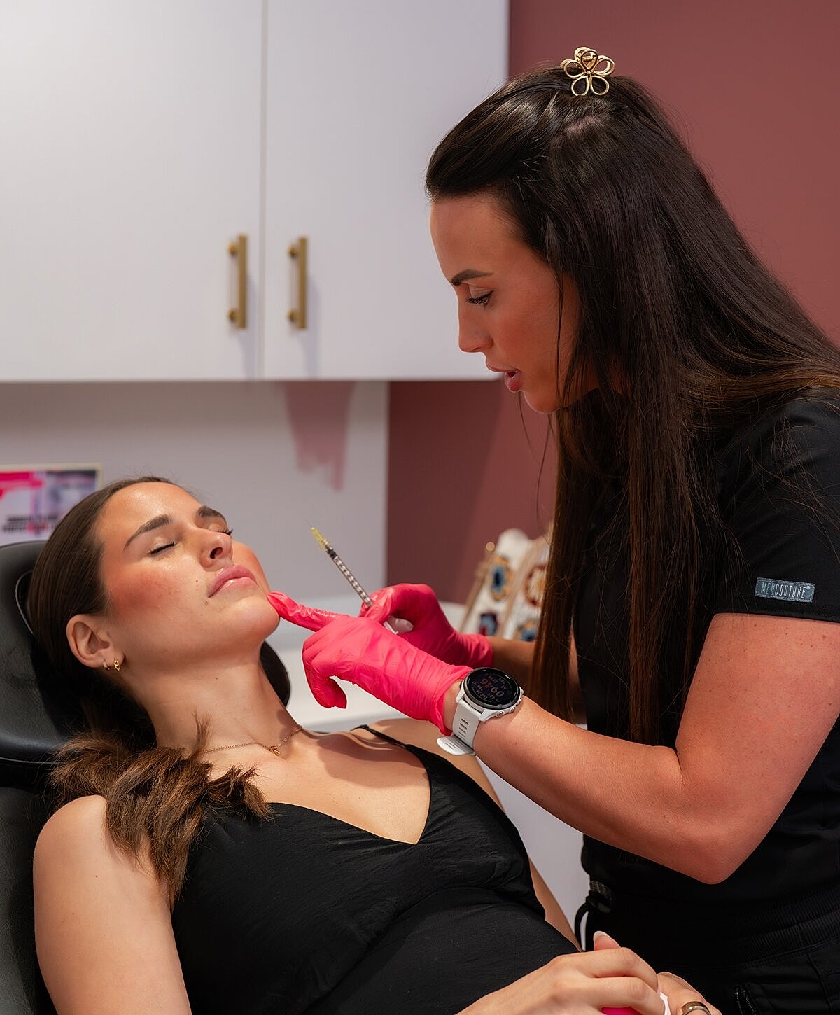 Client enjoying a beauty treatment at salon.
