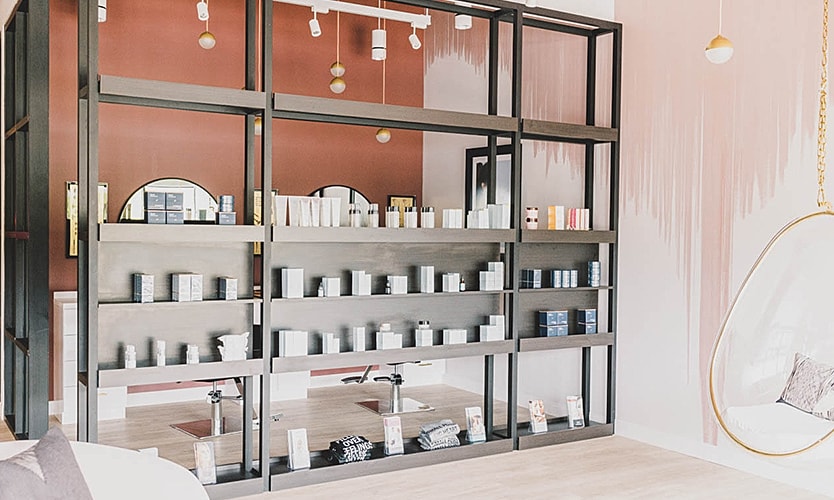 Stylish beauty product display in modern interior.