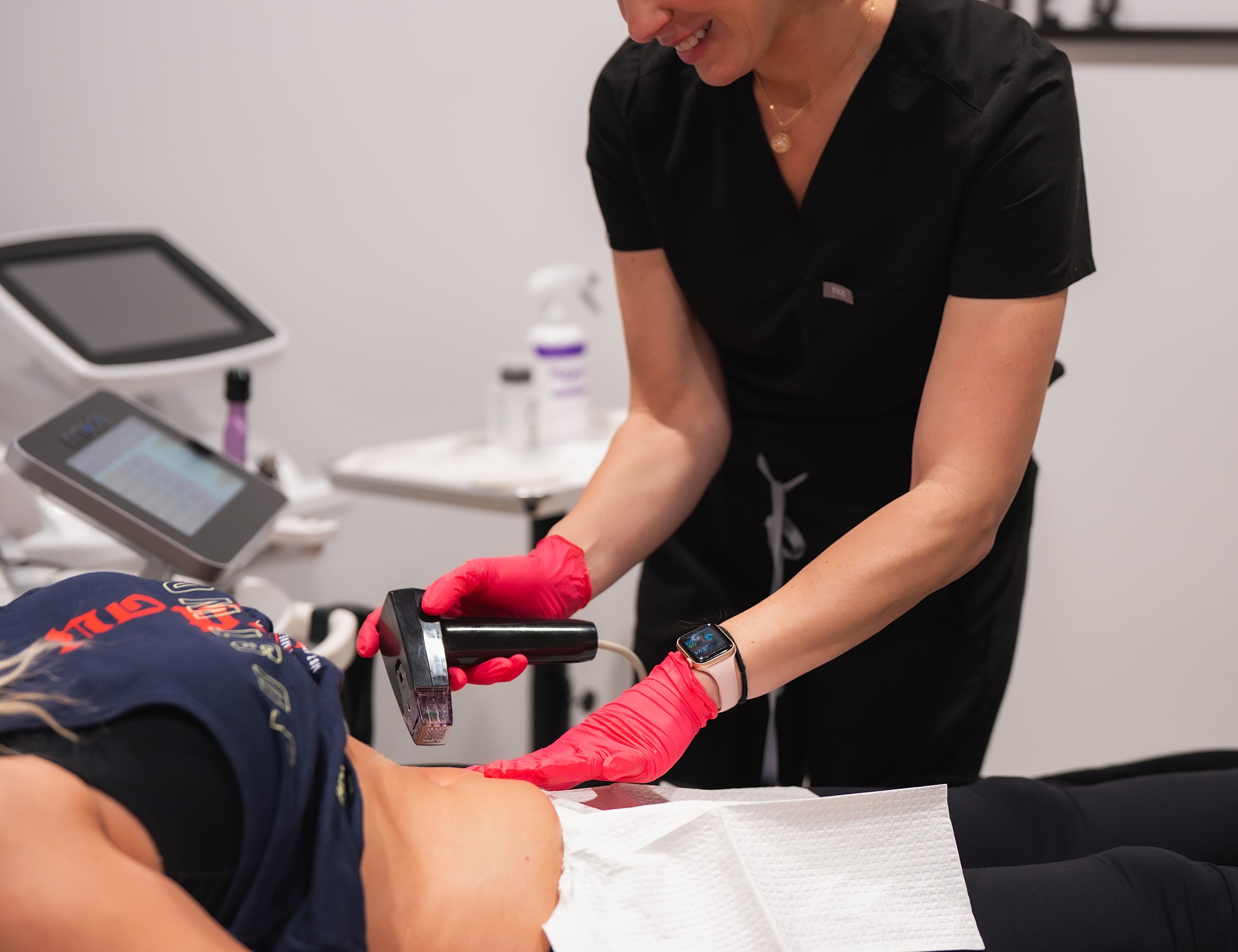 Skin treatment procedure with handheld device in progress.