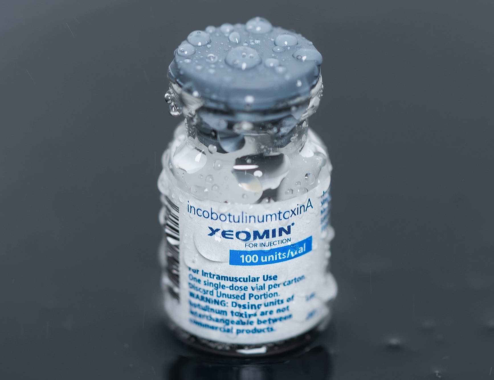XEOMIN vial with condensation on surface.